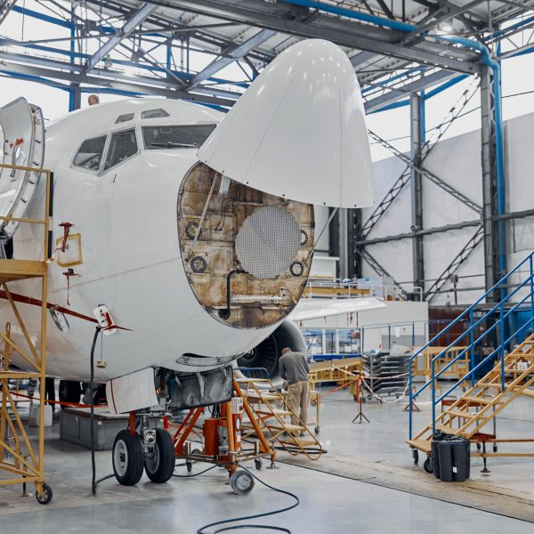 Professional plane expluatation service in big hangar